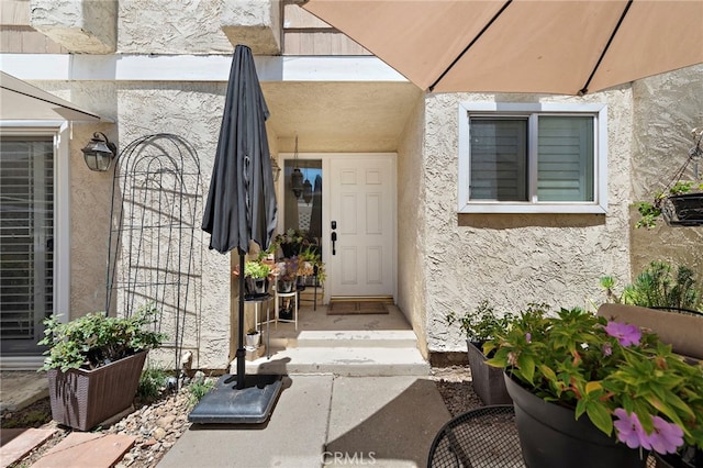 3340 E Collins Ave Unit 30, Orange, CA 92867 - view of exterior entry featuring stucco siding