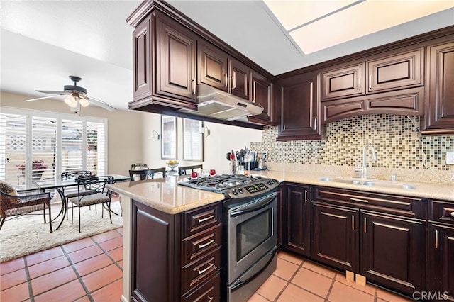3340 E Collins Ave Unit 30, Orange, CA 92867 - kitchen with gas stove, a sink, under cabinet range hood, and light tile patterned floors