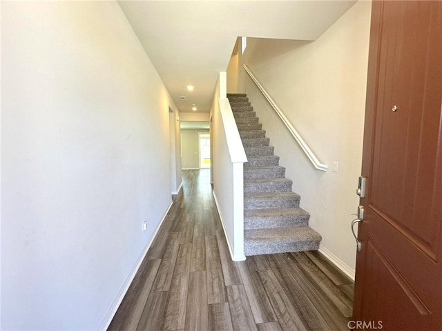 24555 Bravery Cir, Menifee, CA 92584 - stairway featuring wood finished floors, baseboards, and recessed lighting