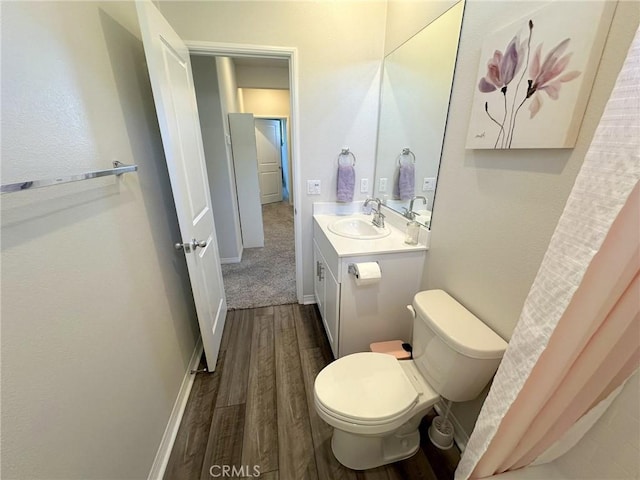 24555 Bravery Cir, Menifee, CA 92584 - bathroom featuring wood finished floors, vanity, and toilet