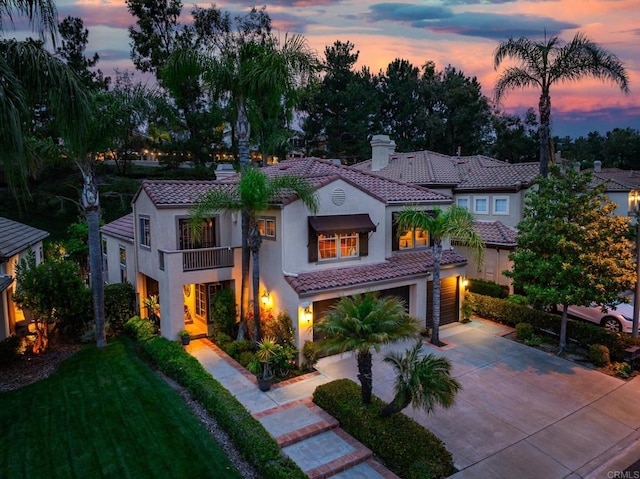 26395 Marsala Way, Mission Viejo, CA 92692 - mediterranean / spanish-style house featuring a balcony, a tile roof, stucco siding, a garage, and concrete driveway
