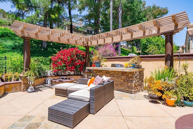 26395 Marsala Way, Mission Viejo, CA 92692 - view of patio with a pergola, an outdoor living space, and an outdoor kitchen
