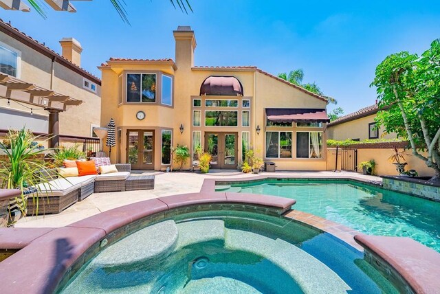 26395 Marsala Way, Mission Viejo, CA 92692 - view of pool featuring french doors, a pool with connected hot tub, fence, and a patio area