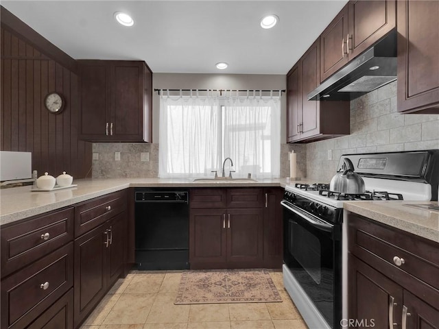 kitchen featuring range with gas cooktop, under cabinet range hood, a sink, black dishwasher, and backsplash
