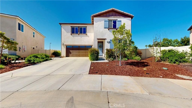 6338 Orion Way, Banning, CA 92220 - view of front of home featuring a garage, stucco siding, and concrete driveway