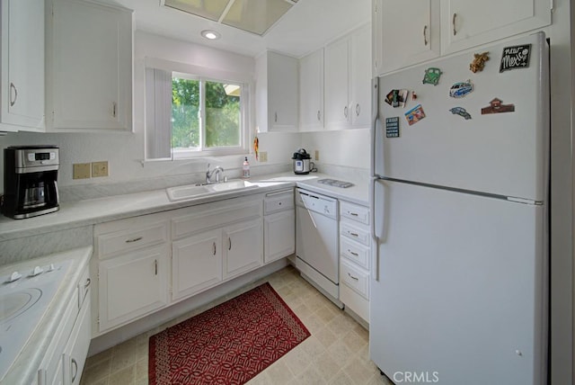 378 Avenida Castilla Unit O, Laguna Woods, CA 92637 - kitchen with white appliances, white cabinetry, light countertops, a sink, and recessed lighting