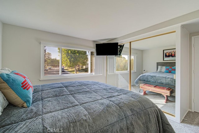 378 Avenida Castilla Unit O, Laguna Woods, CA 92637 - carpeted bedroom with multiple windows, a closet, and baseboards