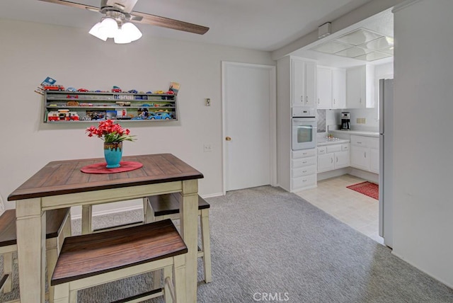 378 Avenida Castilla Unit O, Laguna Woods, CA 92637 - dining space with a ceiling fan and light carpet