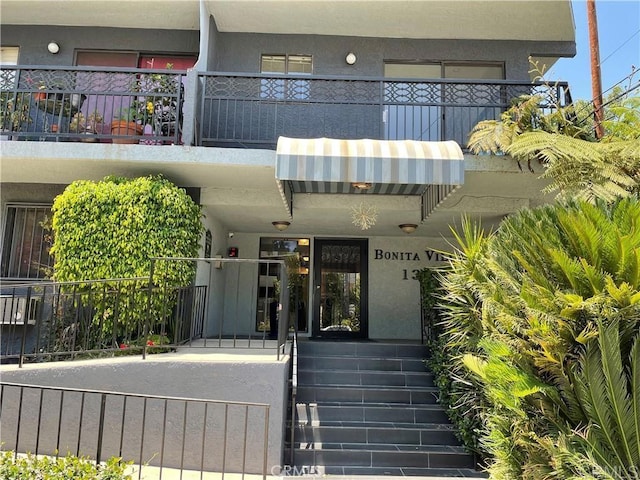 1355 N Sierra Bonita Ave Unit 204, West Hollywood, CA 90046 - property entrance with stucco siding