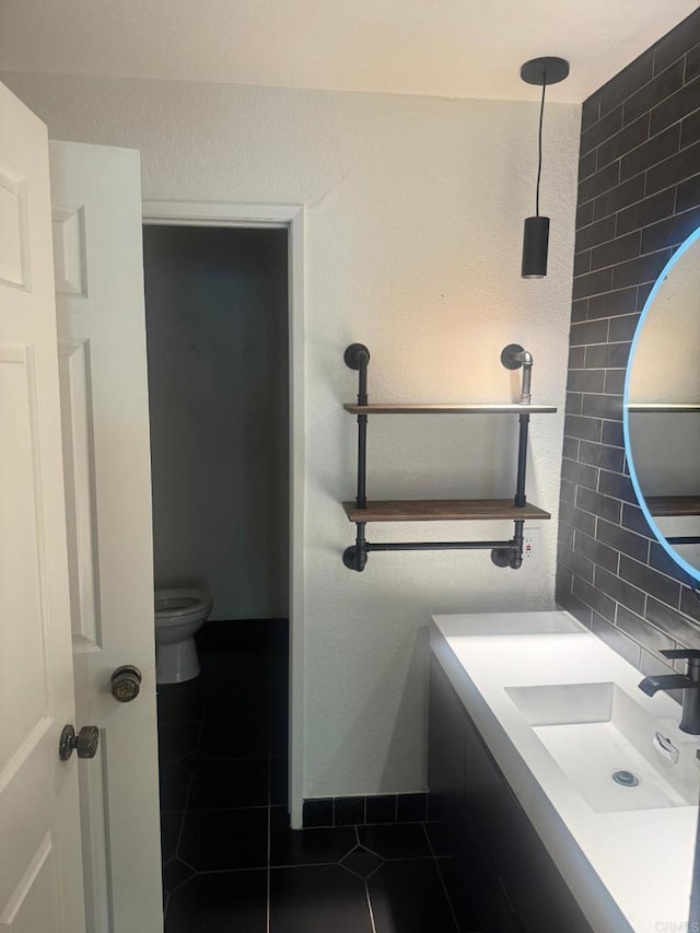 1355 N Sierra Bonita Ave Unit 204, West Hollywood, CA 90046 - bathroom with tile patterned flooring, vanity, and toilet