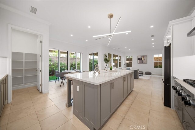 112 Turning Post, Irvine, CA 92620 - kitchen with gray cabinets, open floor plan, freestanding refrigerator, recessed lighting, and light tile patterned floors