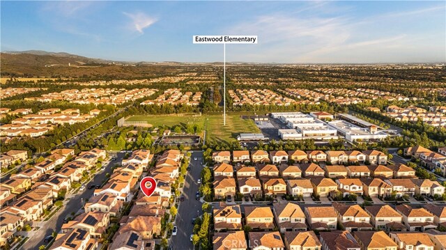 112 Turning Post, Irvine, CA 92620 - aerial overview of property's location with nearby suburban area and a mountainous background