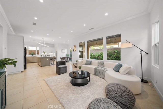 112 Turning Post, Irvine, CA 92620 - living room featuring light tile patterned floors, recessed lighting, baseboards, and ornamental molding