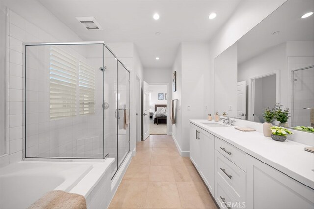 112 Turning Post, Irvine, CA 92620 - ensuite bathroom with vanity, recessed lighting, a shower stall, tile patterned floors, and a garden tub