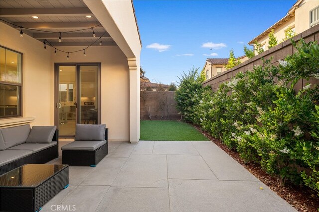 112 Turning Post, Irvine, CA 92620 - fenced backyard with a patio area and an outdoor living space