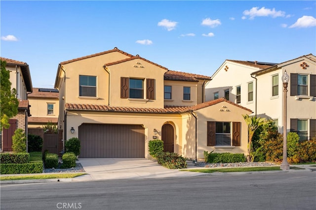112 Turning Post, Irvine, CA 92620 - view of front facade featuring a tile roof, stucco siding, a garage, concrete driveway, and solar panels