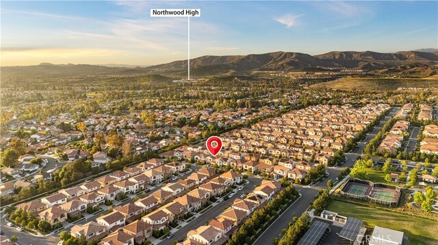 112 Turning Post, Irvine, CA 92620 - aerial overview of property's location with a mountain backdrop and nearby suburban area