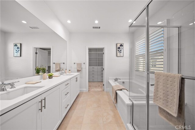 112 Turning Post, Irvine, CA 92620 - full bathroom with double vanity, a garden tub, a stall shower, recessed lighting, and tile patterned floors