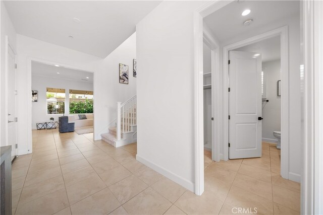 112 Turning Post, Irvine, CA 92620 - hall with stairs, light tile patterned floors, recessed lighting, and baseboards