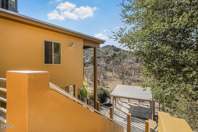 1944 Seminole Dr, Agoura Hills, CA 91301 - view of side of property with stucco siding, a balcony, and a mountain view