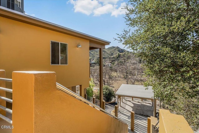 1944 Seminole Dr, Agoura Hills, CA 91301 - view of home's exterior with stucco siding, a mountain view, and a balcony