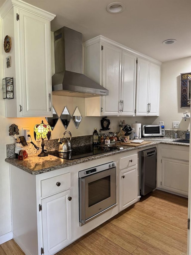 7975 Playmor Ter, San Diego, CA 92122 - kitchen featuring oven, wall chimney exhaust hood, dishwasher, black electric cooktop, and white cabinetry