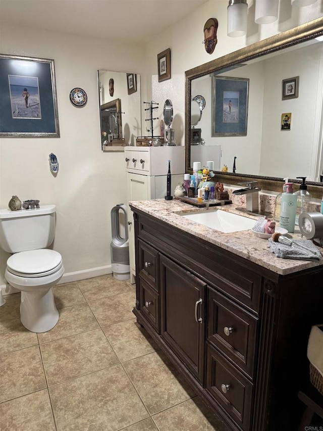 7975 Playmor Ter, San Diego, CA 92122 - bathroom featuring toilet, tile patterned floors, vanity, and baseboards