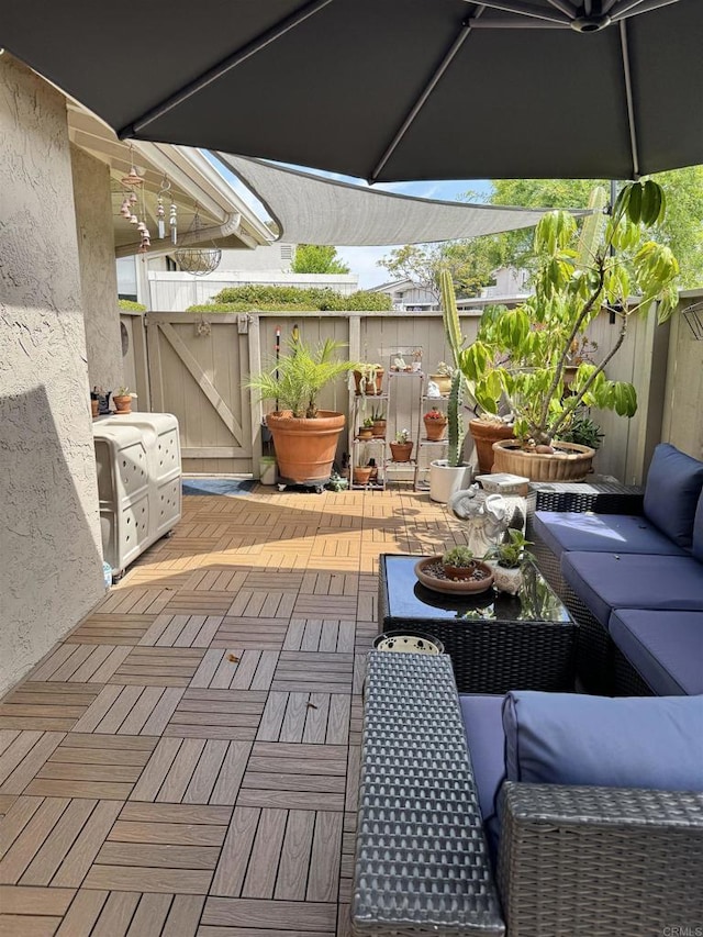 7975 Playmor Ter, San Diego, CA 92122 - view of patio featuring outdoor lounge area, fence, and a gate