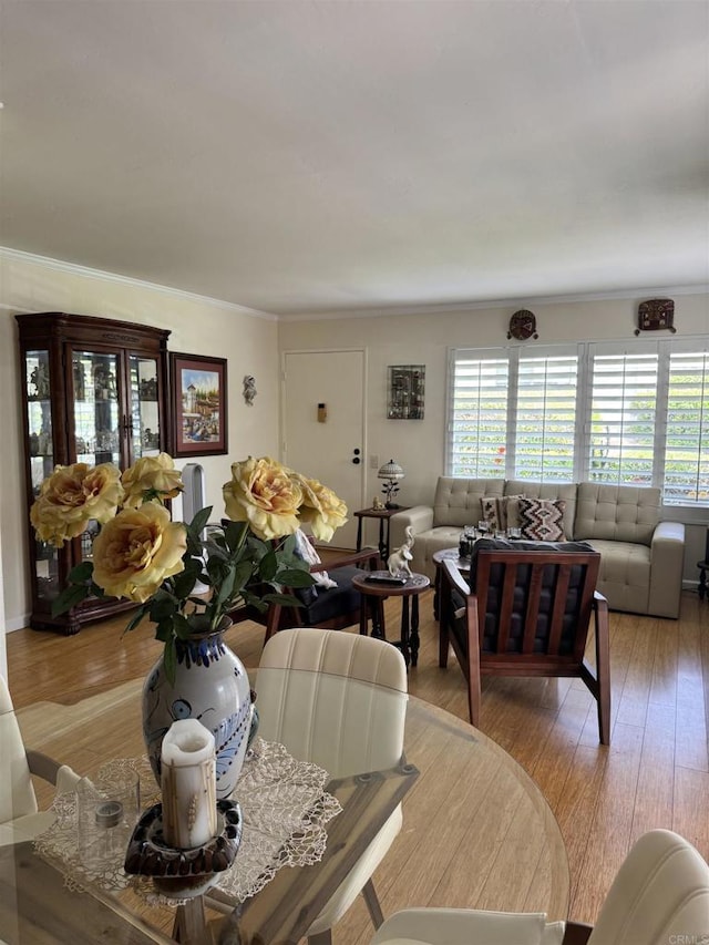 7975 Playmor Ter, San Diego, CA 92122 - dining space featuring ornamental molding and light wood-type flooring