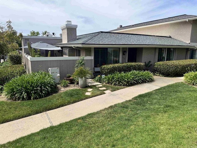 7975 Playmor Ter, San Diego, CA 92122 - view of front of property with stucco siding, a chimney, and a shingled roof