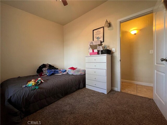 23079 Minnetonka Rd, Apple Valley, CA 92308 - bedroom with carpet floors, tile patterned flooring, and a ceiling fan
