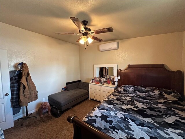 23079 Minnetonka Rd, Apple Valley, CA 92308 - bedroom featuring an AC wall unit, dark carpet, a ceiling fan, and baseboards