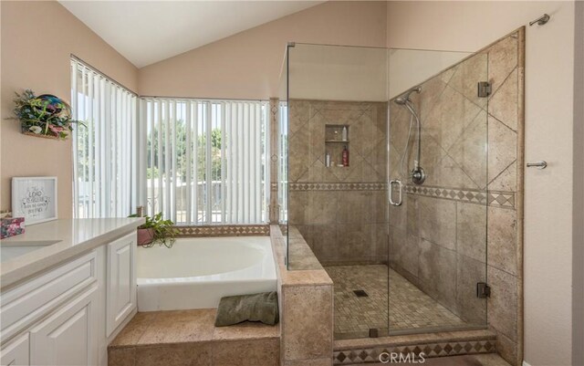 28852 Glenheather Dr, Highland, CA 92346 - full bathroom with a garden tub, vanity, a stall shower, and vaulted ceiling