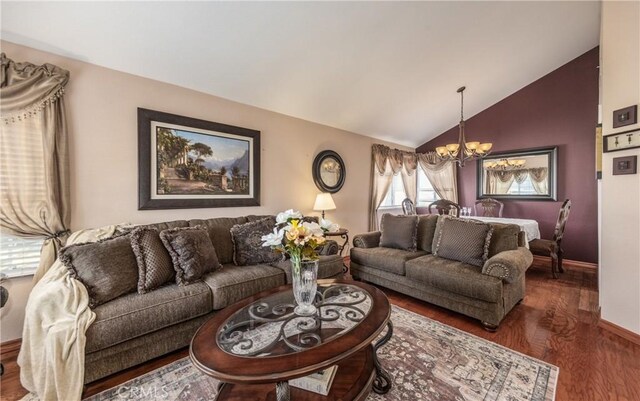 28852 Glenheather Dr, Highland, CA 92346 - living room with a chandelier, wood finished floors, lofted ceiling, and baseboards