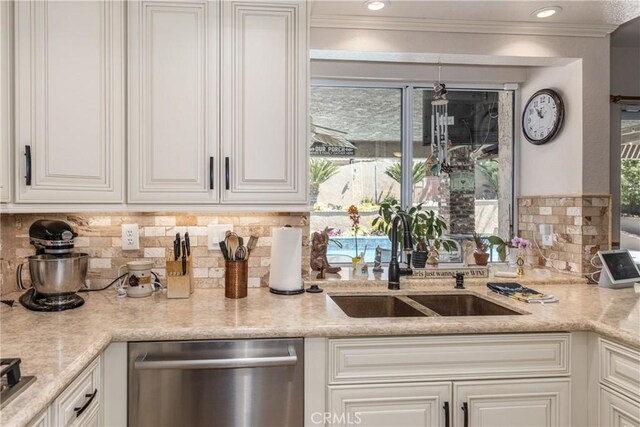 28852 Glenheather Dr, Highland, CA 92346 - kitchen featuring dishwasher, a sink, white cabinetry, tasteful backsplash, and healthy amount of natural light