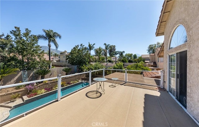 28852 Glenheather Dr, Highland, CA 92346 - view of patio / terrace featuring a balcony and a mountain view