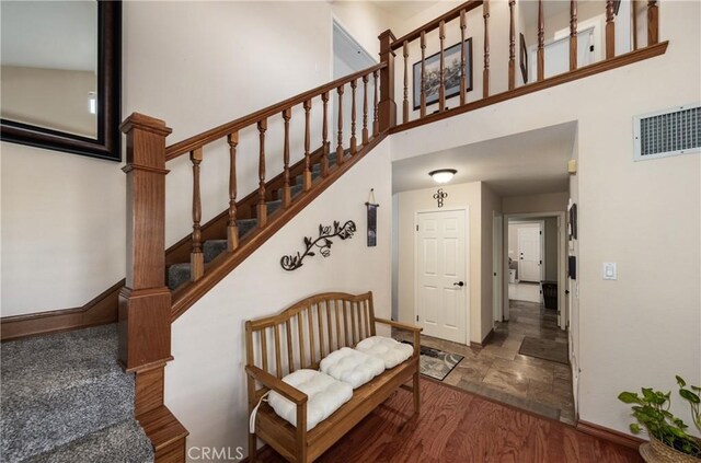 28852 Glenheather Dr, Highland, CA 92346 - stairway with a high ceiling and baseboards