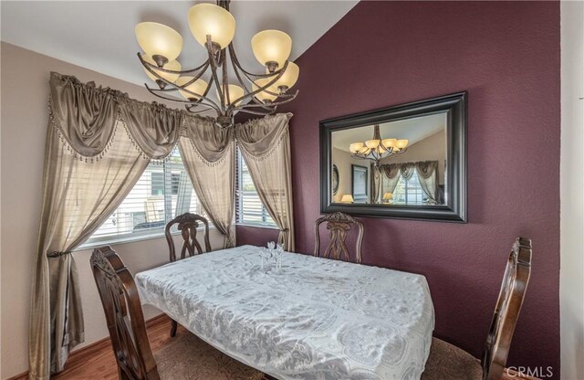 28852 Glenheather Dr, Highland, CA 92346 - dining space with a chandelier, wood finished floors, and baseboards