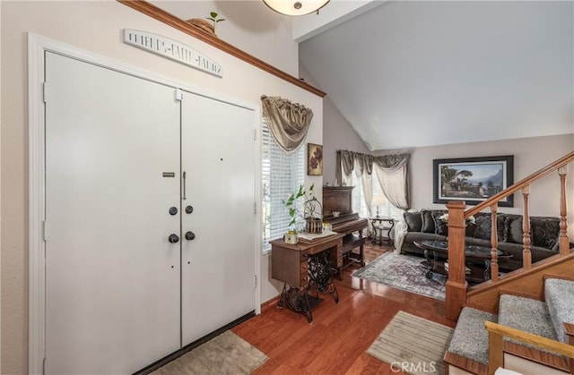 28852 Glenheather Dr, Highland, CA 92346 - foyer entrance featuring wood finished floors, stairs, and vaulted ceiling