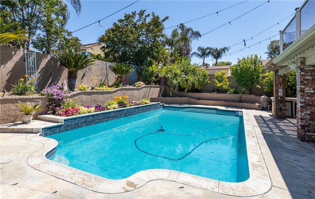 28852 Glenheather Dr, Highland, CA 92346 - view of pool featuring a fenced backyard and a patio