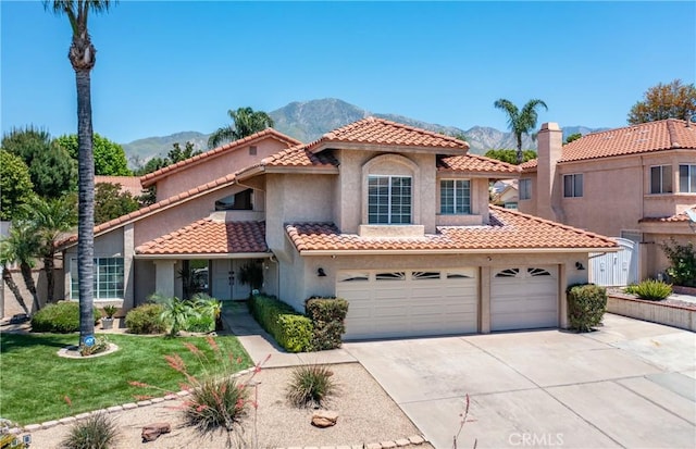 28852 Glenheather Dr, Highland, CA 92346 - mediterranean / spanish house featuring a mountain view, driveway, stucco siding, and a tile roof