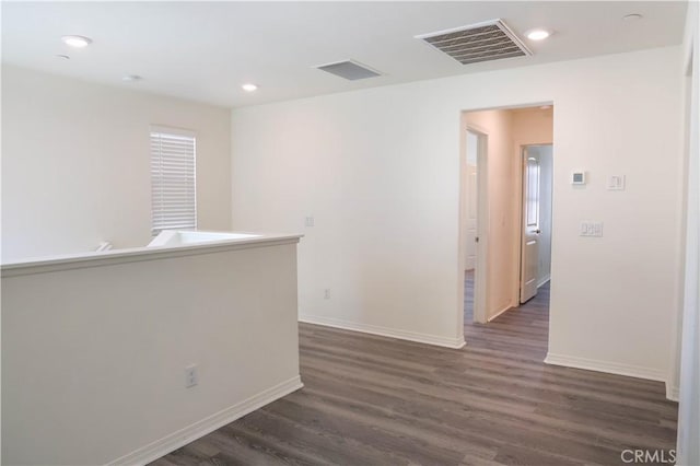13936 Blossom Way, Eastvale, CA 92880 - spare room featuring dark wood-type flooring, baseboards, and recessed lighting