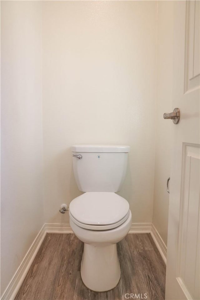 13936 Blossom Way, Eastvale, CA 92880 - bathroom with wood finished floors, baseboards, and toilet