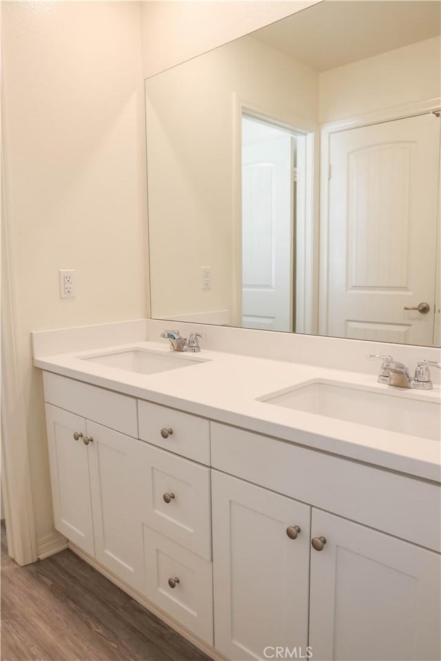 13936 Blossom Way, Eastvale, CA 92880 - bathroom with double vanity and wood finished floors