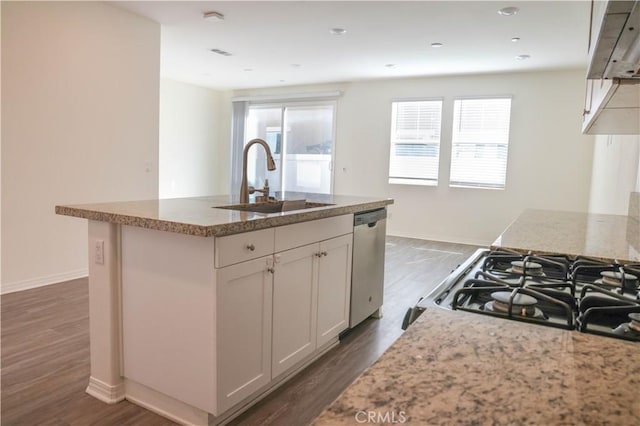 13936 Blossom Way, Eastvale, CA 92880 - kitchen featuring a sink, appliances with stainless steel finishes, wood finished floors, and light stone countertops
