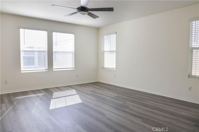 13936 Blossom Way, Eastvale, CA 92880 - spare room with dark wood-style flooring, a ceiling fan, and baseboards