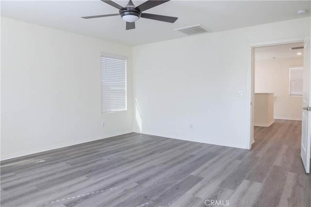 13936 Blossom Way, Eastvale, CA 92880 - unfurnished room with wood finished floors, a smoke detector, baseboards, and ceiling fan