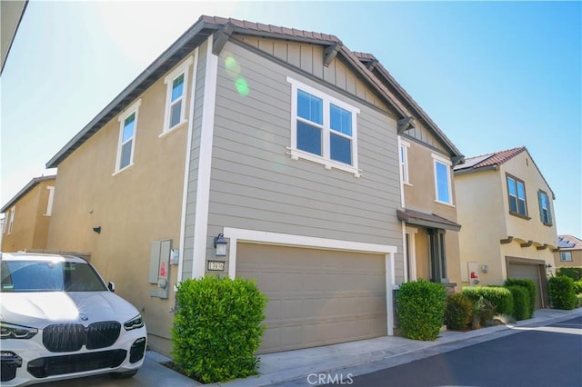 13936 Blossom Way, Eastvale, CA 92880 - view of front of property featuring an attached garage and stucco siding