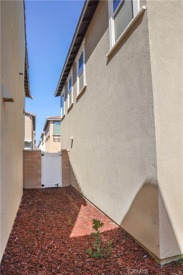 13936 Blossom Way, Eastvale, CA 92880 - view of side of home featuring stucco siding