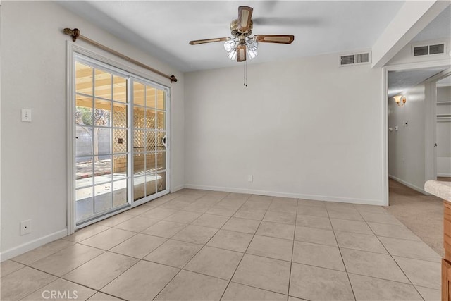 560 E Mountain View St, Barstow, CA 92311 - spare room with a ceiling fan, light tile patterned flooring, and baseboards